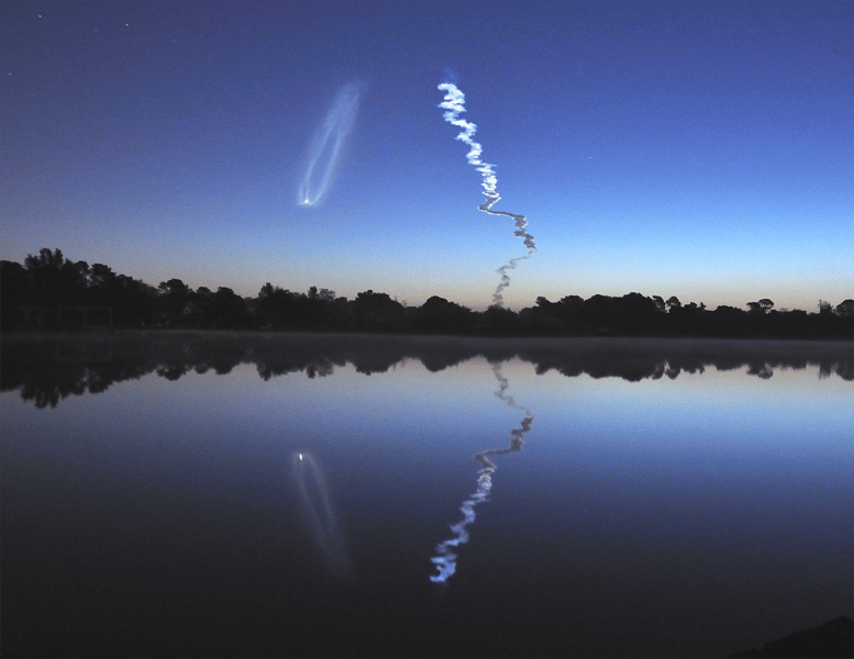 STS 131 4/5/2010 Contrail lit by sun before sunrise.  An unusual northern trajectory, with the orbiter following the curvature of the earth and appearing to move downward.  The bright spot is the orbiter’s main engines still firing